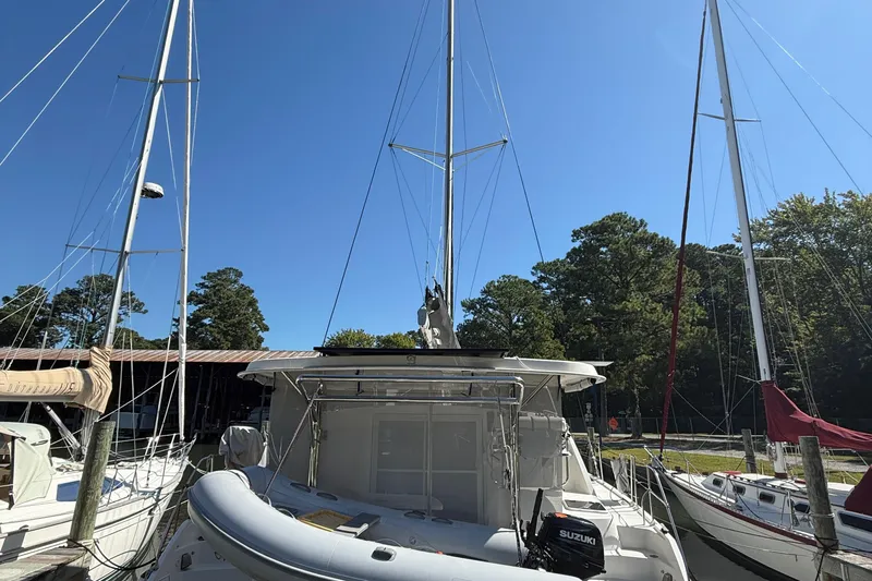 Selah Yacht Photos Pics 2010 Leopard 38 catamaran docked at marina with clear blue sky.