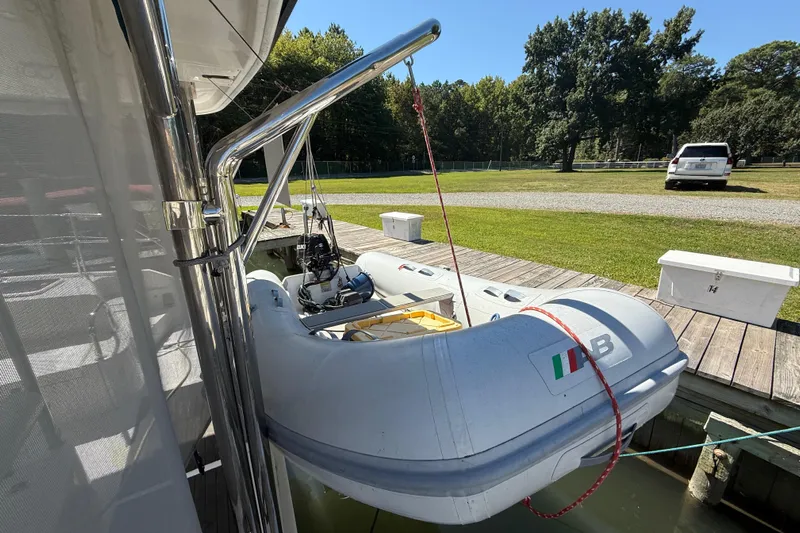 Selah Yacht Photos Pics Inflatable boat on Leopard 38 yacht, docked near grassy area, 2010 model.