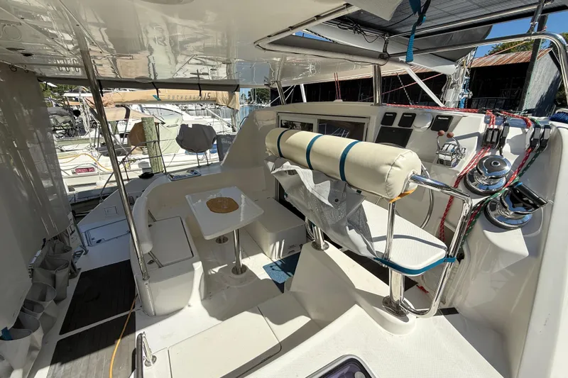Selah Yacht Photos Pics Interior view of a 2010 Leopard 38 catamaran cockpit with seating and navigation controls.