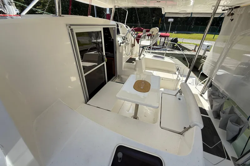 Selah Yacht Photos Pics 2010 Leopard 38 catamaran cockpit with seating, table, and helm station.