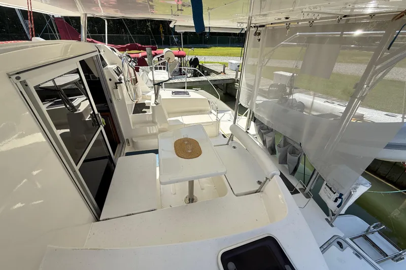 Selah Yacht Photos Pics 2010 Leopard 38 catamaran interior with seating area and helm station.