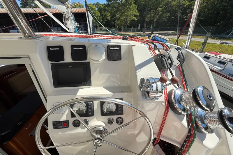 Selah Yacht Photos Pics Helm of 2010 Leopard 38 catamaran with navigation instruments and steering wheel.