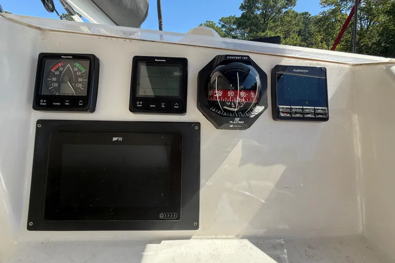 Selah Yacht Photos Pics Control panel of a 2010 Leopard 38 boat with navigation instruments.