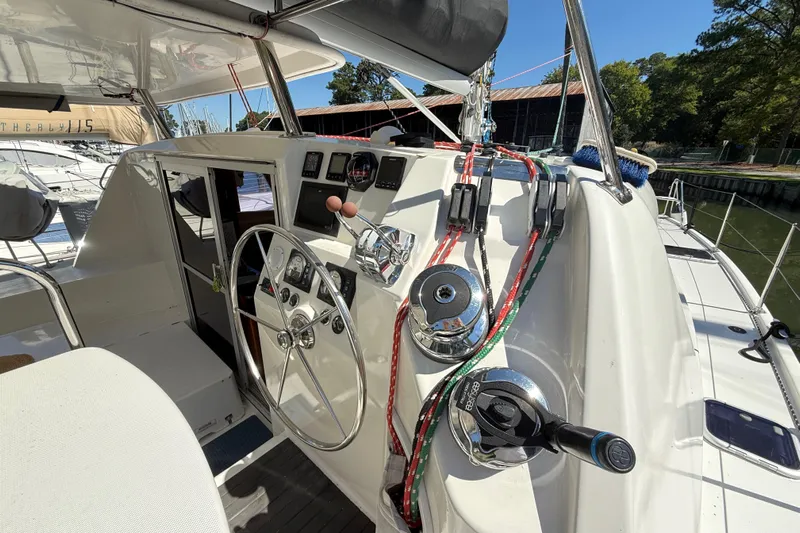 Selah Yacht Photos Pics Cockpit of 2010 Leopard 38 catamaran with steering wheel and control panel.