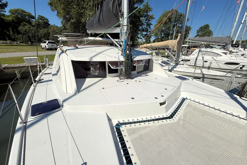 Selah Yacht Photos Pics 2010 Leopard 38 catamaran docked, showcasing deck and rigging under clear blue sky.