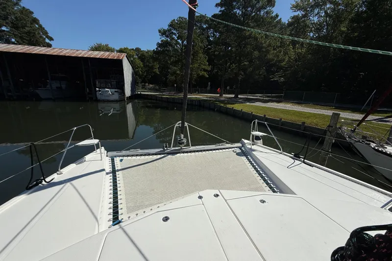 Selah Yacht Photos Pics 2010 Leopard 38 catamaran docked in a serene marina setting.