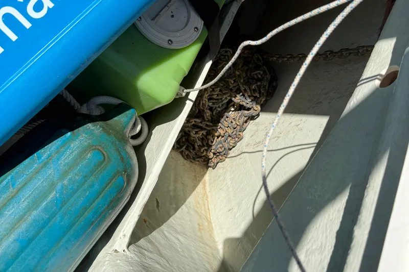 Selah Yacht Photos Pics Boat equipment storage with ropes, chains, and fenders on a 2010 Leopard 38.