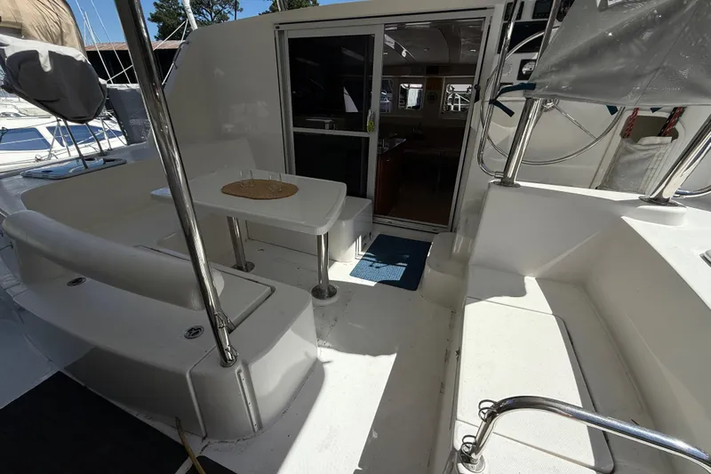 Selah Yacht Photos Pics 2010 Leopard 38 yacht cockpit with seating, table, and helm station.