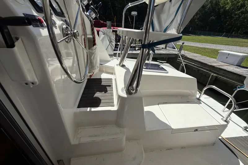 Selah Yacht Photos Pics 2010 Leopard 38 yacht cockpit with steering wheel and seating area.