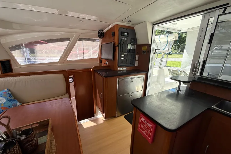 Selah Yacht Photos Pics Interior of 2010 Leopard 38 yacht with modern kitchen and seating area.