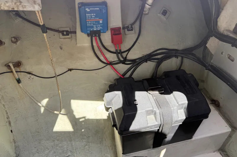 Selah Yacht Photos Pics Battery compartment of a 2010 Leopard 38 with wiring and charger.