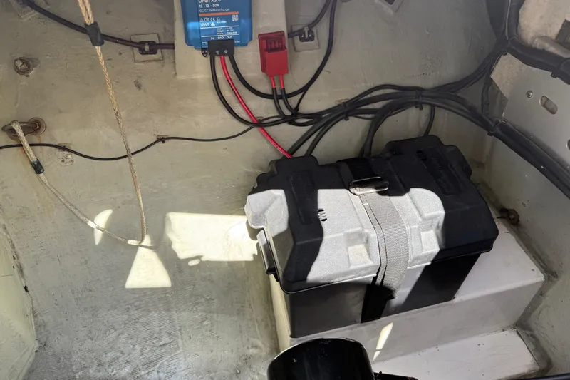 Selah Yacht Photos Pics Battery compartment of a 2010 Leopard 38 boat with wiring and charger.