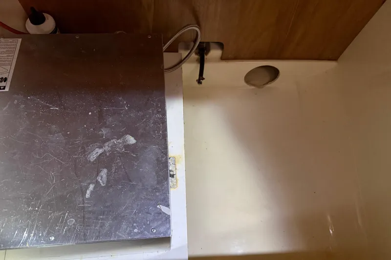 Selah Yacht Photos Pics Interior of a 2010 Leopard 38 boat showing a metal panel and wooden wall.