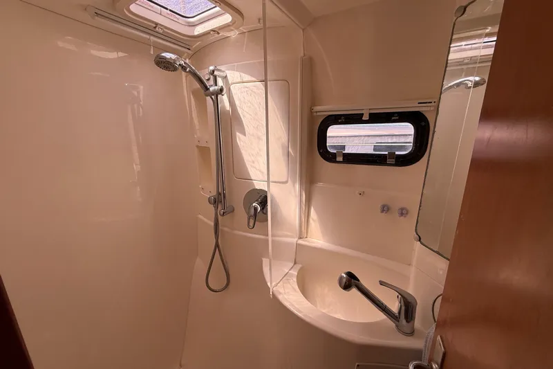 Selah Yacht Photos Pics Bathroom interior of a 2010 Leopard 38 yacht with shower and sink.