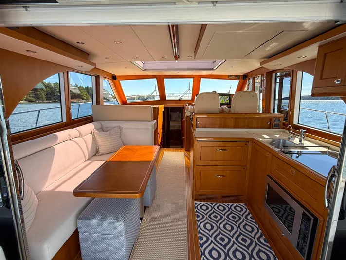 Mystique Yacht Photos Pics Luxurious interior of 2014 Grand Banks 50 Eastbay SX yacht with elegant wood finishes.