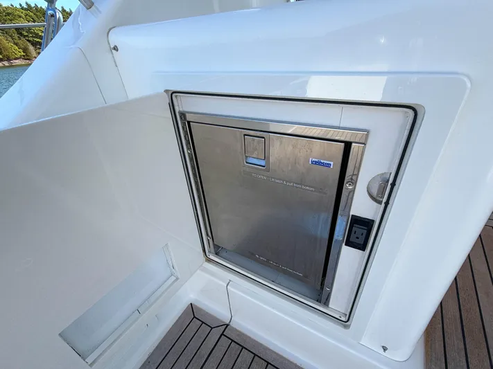 Mystique Yacht Photos Pics Built-in refrigerator on 2014 Grand Banks 50 Eastbay SX yacht deck.