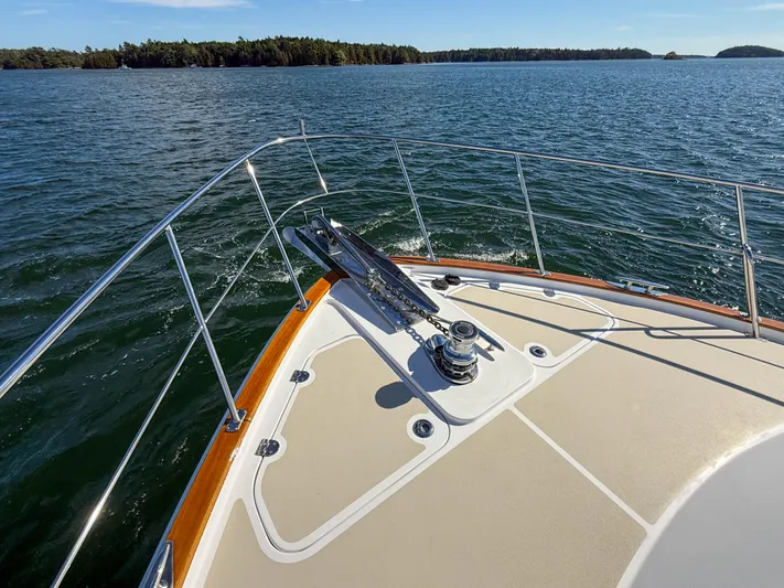 Mystique Yacht Photos Pics Bow of 2014 Grand Banks 50 Eastbay SX yacht on open water.