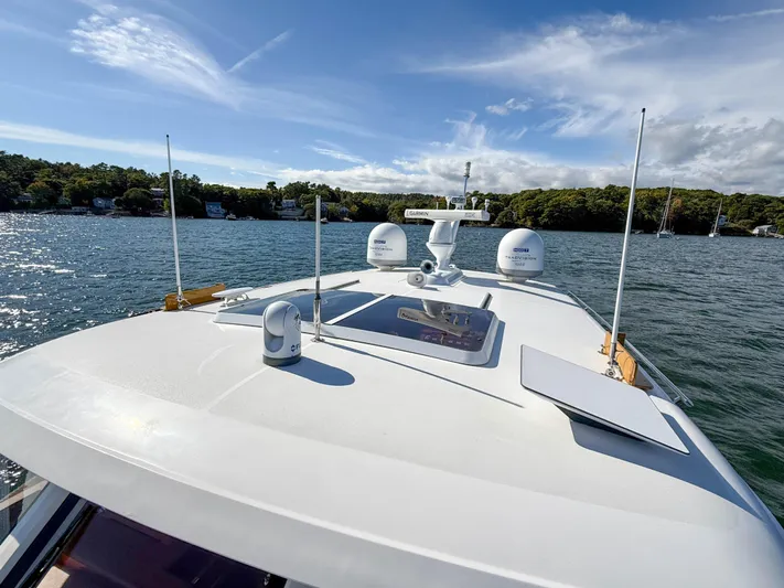 Mystique Yacht Photos Pics 2014 Grand Banks 50 Eastbay SX yacht on water, showcasing sleek design and advanced equipment.