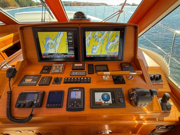 Mystique Yacht Photos Pics Helm of 2014 Grand Banks 50 Eastbay SX with navigation screens and controls.