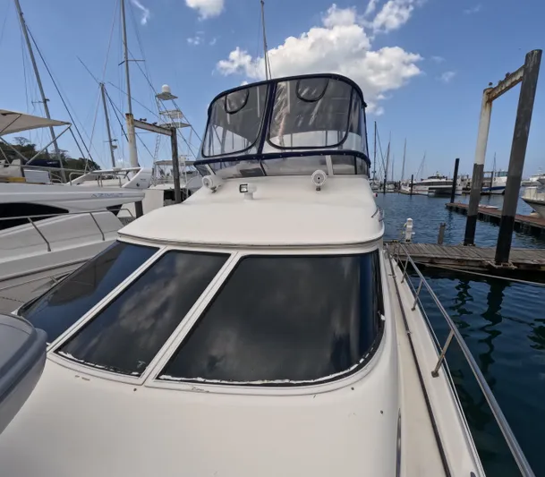  Yacht Photos Pics 2003 Sea Ray 435 yacht docked at marina under blue sky.
