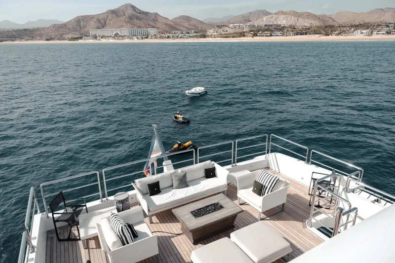  Yacht Photos Pics Luxurious 2018 Majesty 125 yacht deck with ocean view and distant mountains.