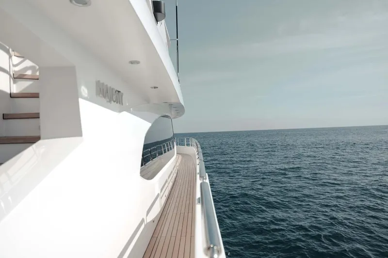  Yacht Photos Pics Luxurious 2018 Majesty 125 yacht cruising on open sea under clear sky.