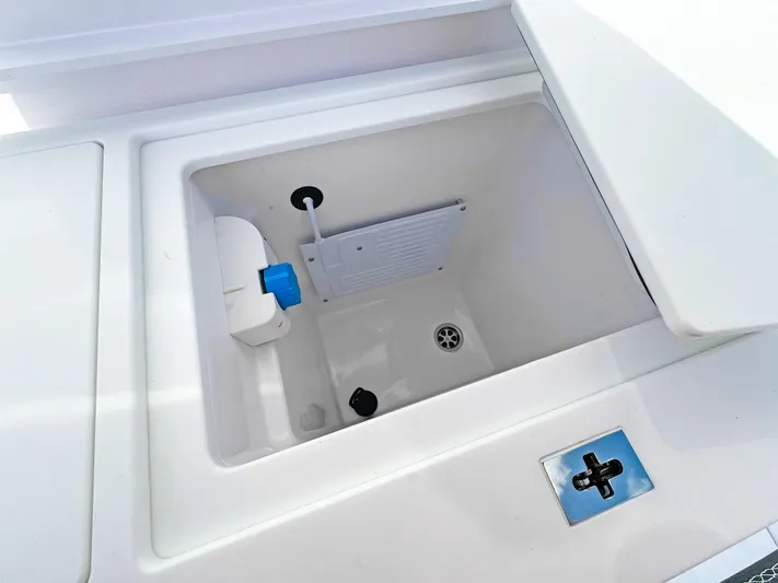  Yacht Photos Pics 2024 Axopar 37 Sun Top storage compartment with drain and latch.