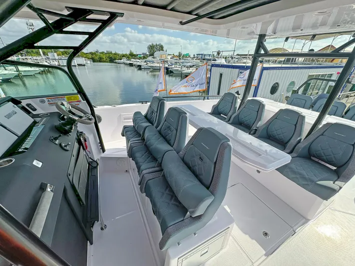  Yacht Photos Pics 2024 Axopar 37 Sun Top boat interior with sleek seating and modern design.