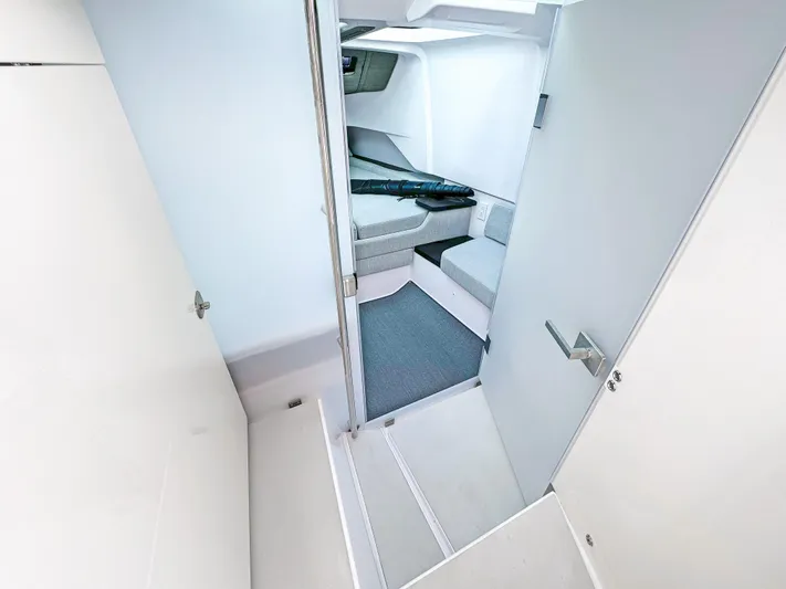  Yacht Photos Pics 2024 Axopar 37 Sun Top interior cabin with modern design and seating area.