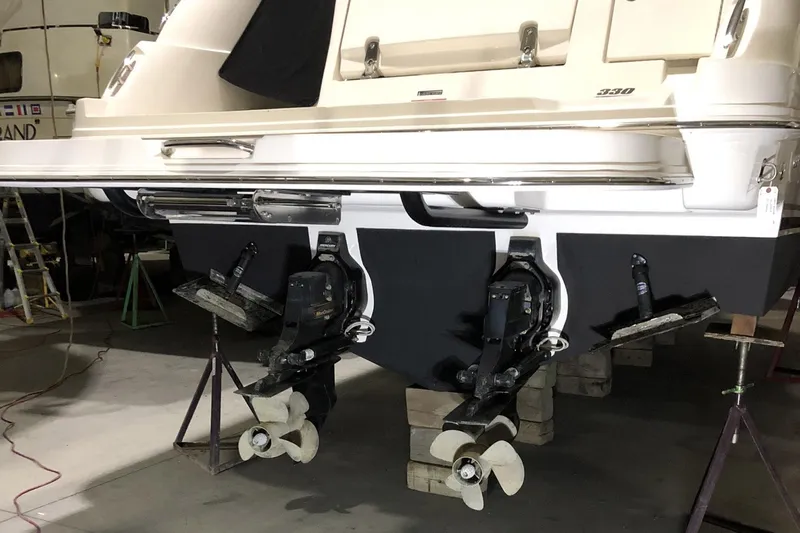 Harborviewbayview Yacht Photos Pics 2016 Sea Ray 330 Sundancer boat on stands, showing dual propellers and stern details.