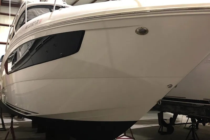 Harborviewbayview Yacht Photos Pics 2016 Sea Ray 330 Sundancer boat in storage, showcasing sleek white hull design.