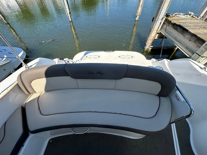 Harborviewbayview Yacht Photos Pics 2016 Sea Ray 330 Sundancer boat with cushioned seating at the stern, docked by the water.