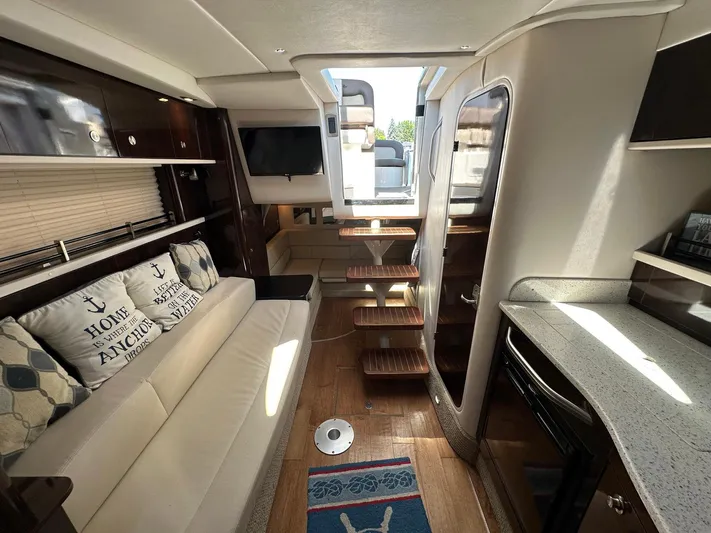 Harborviewbayview Yacht Photos Pics Interior of 2016 Sea Ray 330 Sundancer yacht with modern furnishings and cozy seating area.