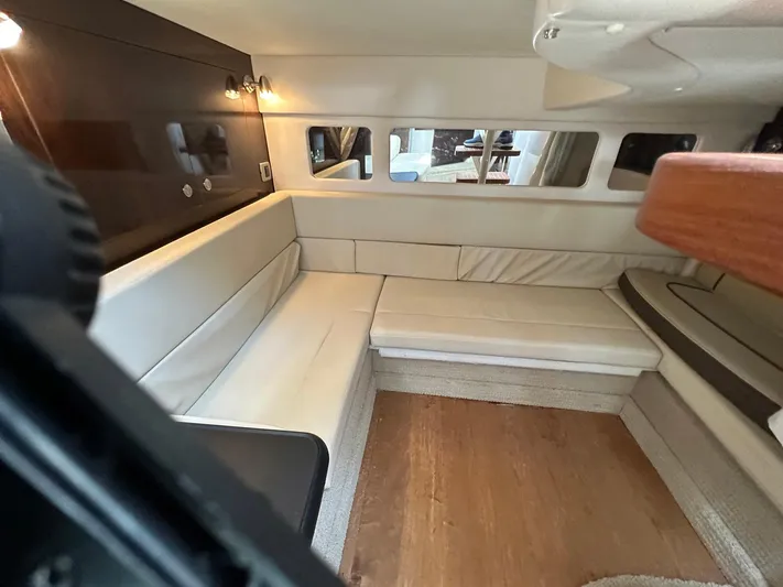 Harborviewbayview Yacht Photos Pics Interior of 2016 Sea Ray 330 Sundancer with beige seating and wooden accents.