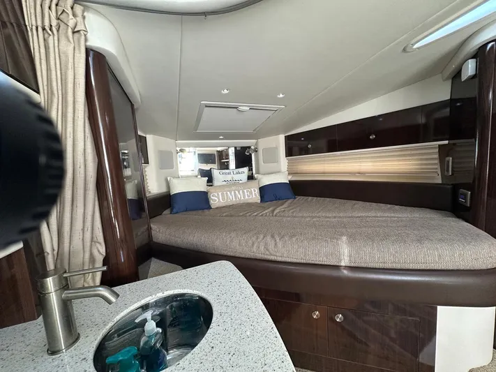 Harborviewbayview Yacht Photos Pics Luxurious interior of 2016 Sea Ray 330 Sundancer yacht with cozy bed and sink.