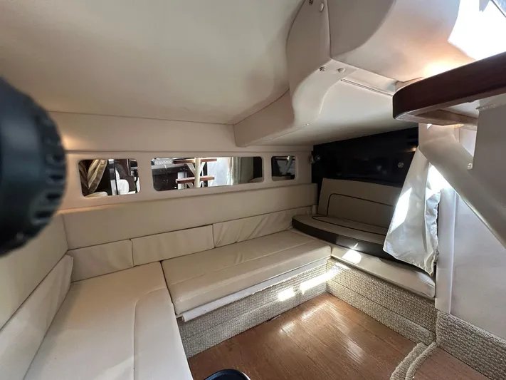 Harborviewbayview Yacht Photos Pics Interior cabin of 2016 Sea Ray 330 Sundancer with beige seating and wood flooring.