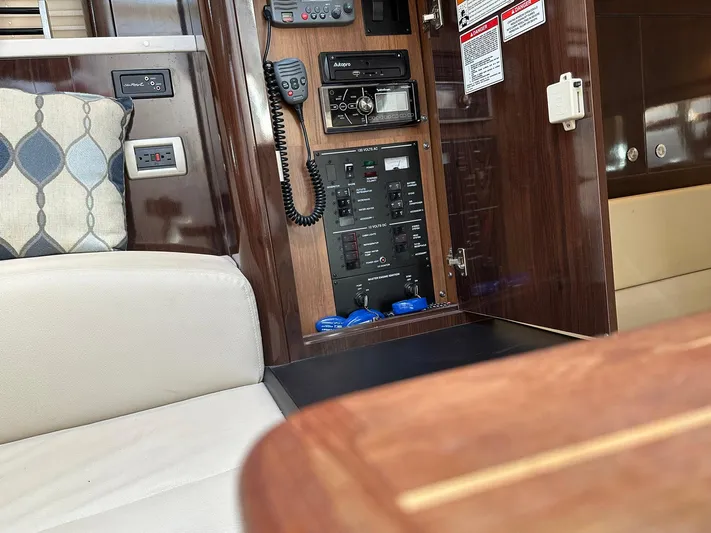 Harborviewbayview Yacht Photos Pics Interior of 2016 Sea Ray 330 Sundancer showing control panel and seating area.