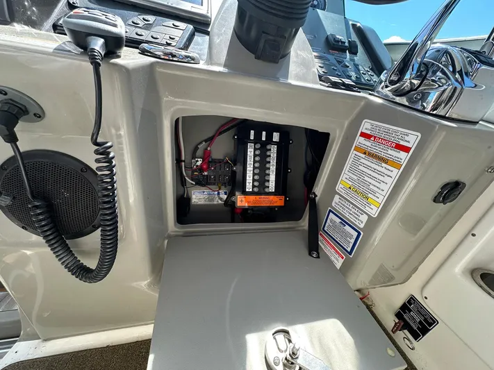 Harborviewbayview Yacht Photos Pics Control panel of a 2016 Sea Ray 330 Sundancer boat, featuring switches and safety labels.