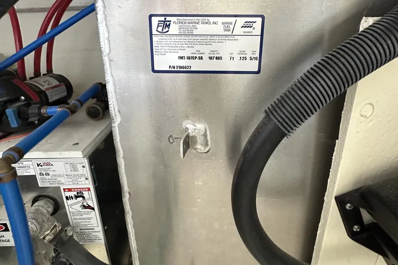 Harborviewbayview Yacht Photos Pics Engine compartment of 2016 Sea Ray 330 Sundancer with fuel tank label and hoses.