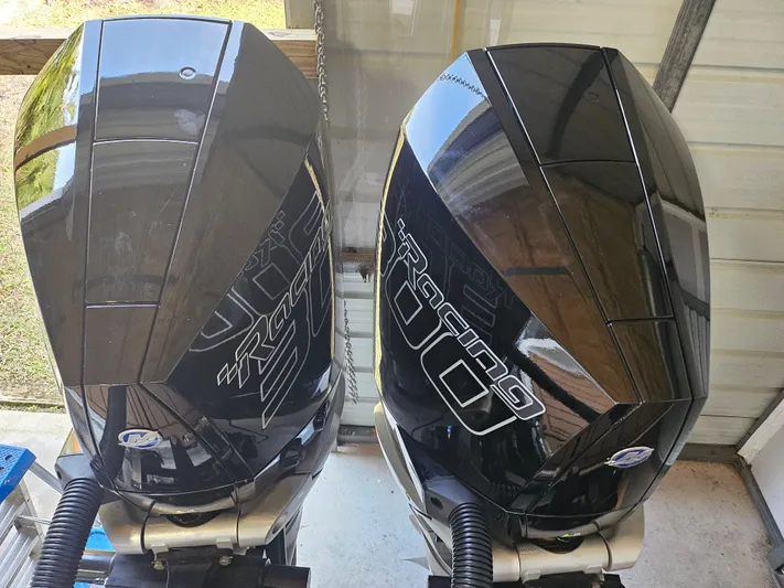  Yacht Photos Pics Two black Statement 350 Open outboard motors, 2021 model, in a garage setting.