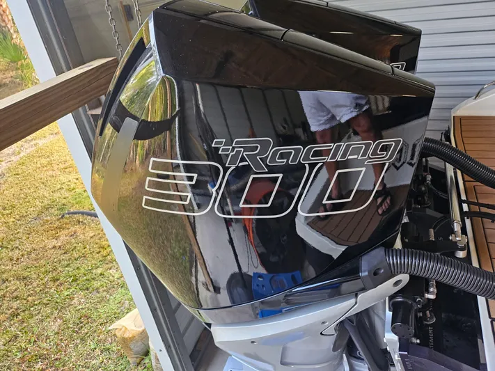  Yacht Photos Pics Outboard motor with "Racing 300" decal on a 2021 Statement 350 Open boat.