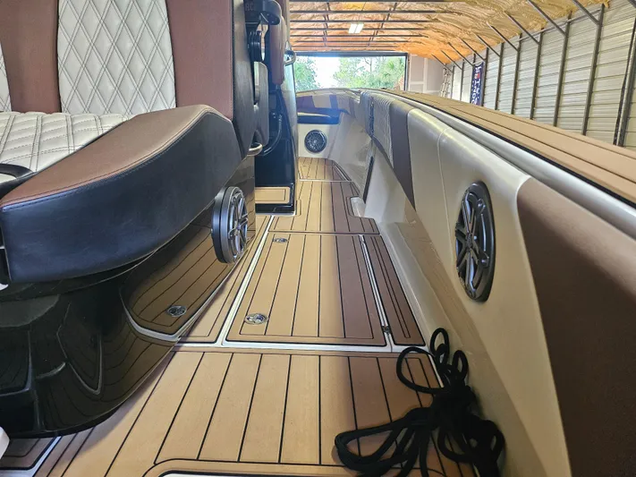  Yacht Photos Pics Luxurious interior of 2021 Statement 350 Open boat with elegant seating and wood flooring.