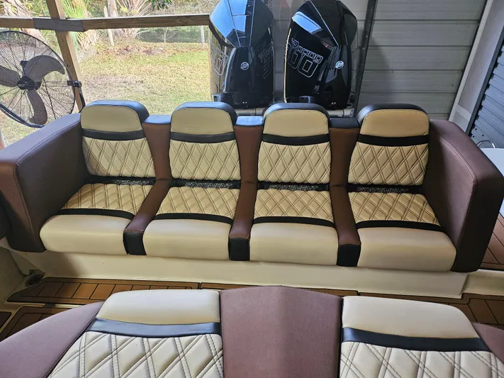  Yacht Photos Pics Luxurious seating on 2021 Statement 350 Open boat, featuring quilted upholstery and dual engines.