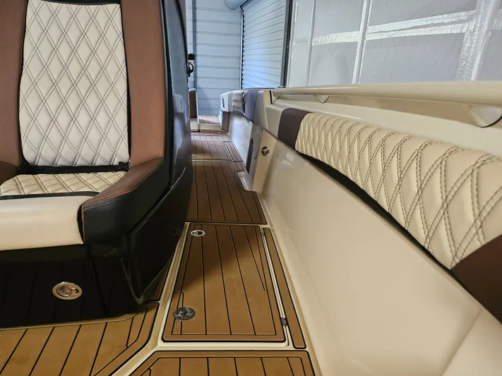  Yacht Photos Pics Luxurious interior of 2021 Statement 350 Open boat with diamond-stitched seating and teak flooring.