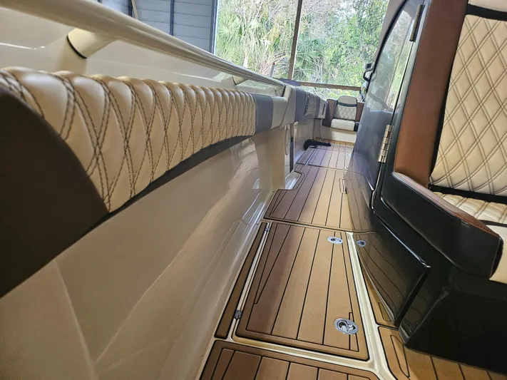  Yacht Photos Pics Luxurious interior of 2021 Statement 350 Open boat with elegant seating and wood flooring.