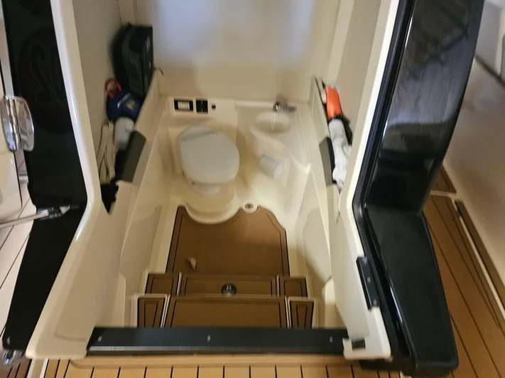  Yacht Photos Pics Interior of 2021 Statement 350 Open boat, featuring a compact marine toilet.