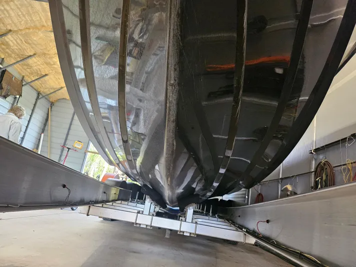  Yacht Photos Pics 2021 Statement 350 Open boat hull in a workshop setting.