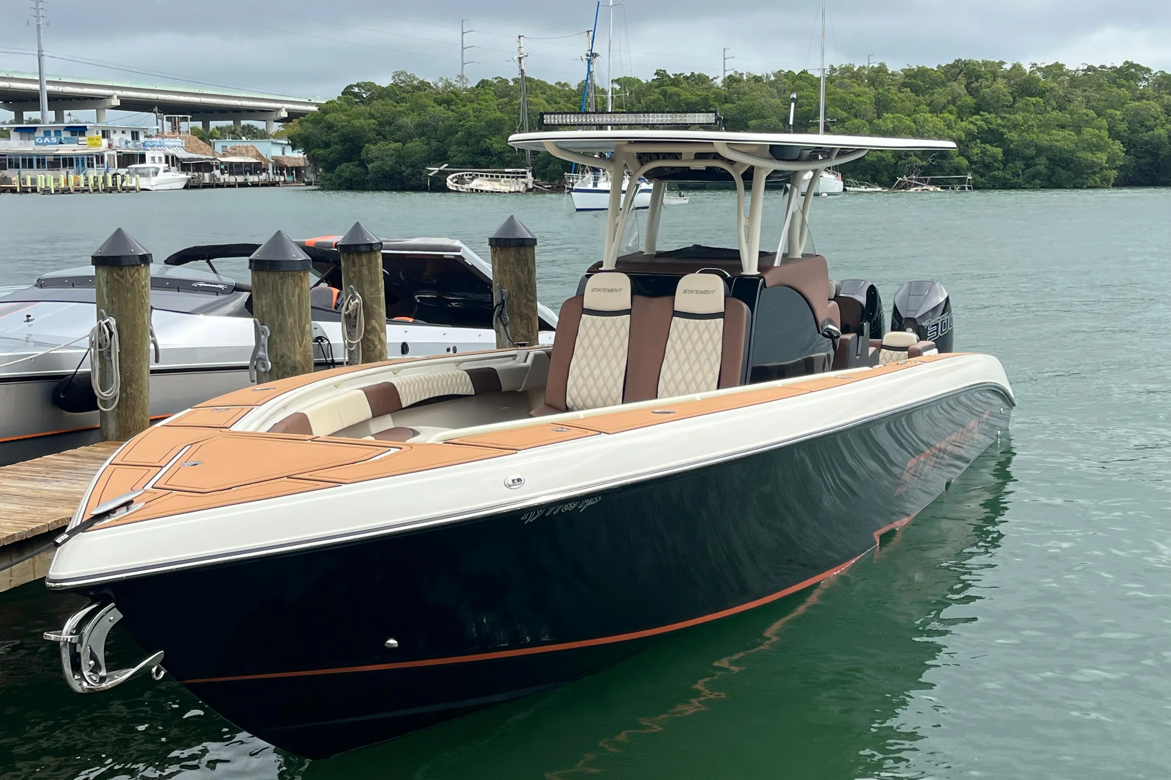 2021 Statement 350 Open boat docked on calm water, featuring sleek design and modern amenities.