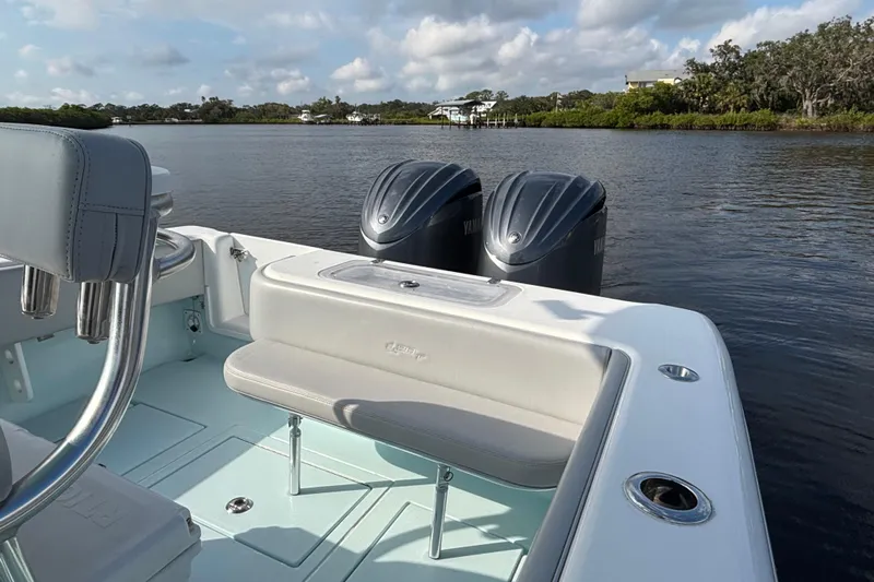  Yacht Photos Pics 2023 Contender 28 Sport boat with dual Yamaha engines on a calm river.