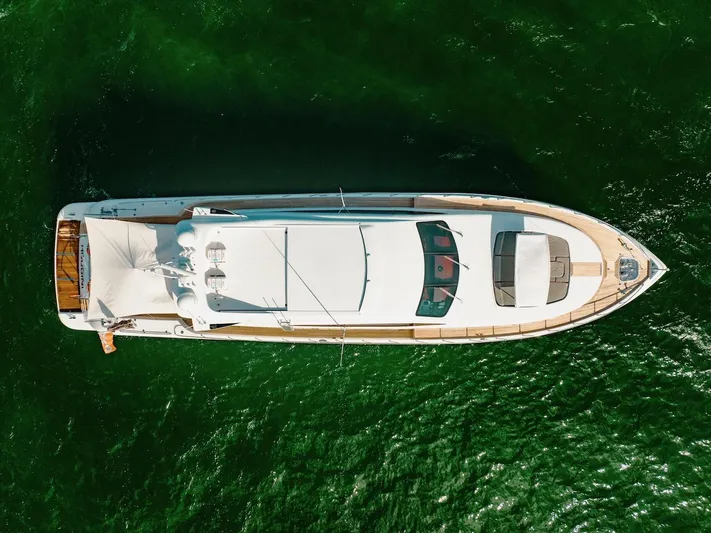 Houdini Yacht Photos Pics Aerial view of 2007 Mangusta 92 yacht on green water.